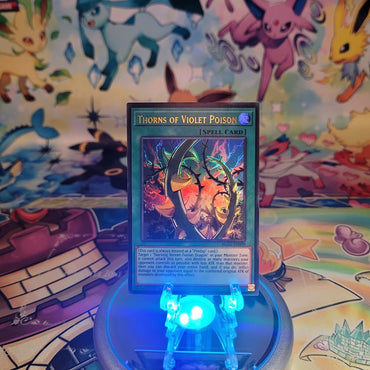 An Ultra Rare "Thorns of Violet Poison" card from the Yugioh Set: Battles of Legend: Glorious Gallery (BLGG).