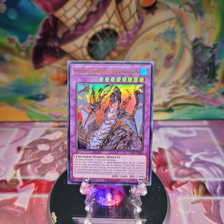 An Ultra Rare "Thunder Dragon Colossus" card from the Yugioh Set: Quarter Century Bonanza (RA03).