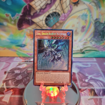 A Secret  Rare "Tidal, Dragon Ruler of Waterfalls" card from the Yugioh Set: Quarter Century Bonanza (RA03).