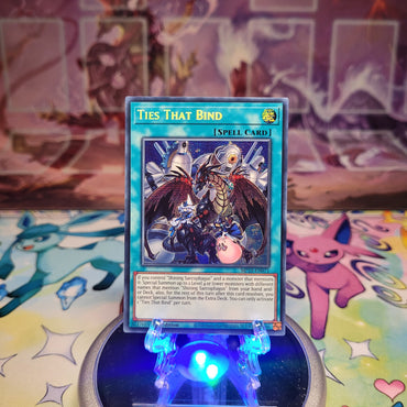 A Prismatic Secret Rare "Ties That Bind" card from the Yugioh 2025 Mega-Tins Mega Pack set (MP25).