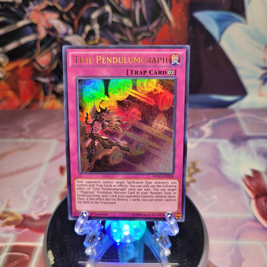 An Ultra Rare "Time Pendulumgraph" card from the Yugioh Set: Pendulum Evolution (PEVO).
