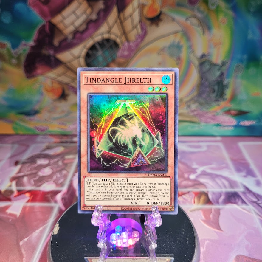 A Super Rare "Tindangle Jhrelth" card from the Yugioh Set: Dawn of Majesty.