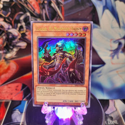 An Ultra Rare "Tlakalel, His Malevolent Majesty" card from the Yugioh Set: Rising Rampage.