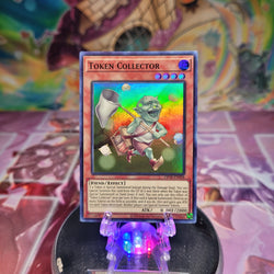 A Super Rare "Token Collector" card from the Yugioh OTS Tournament Pack 18 set.