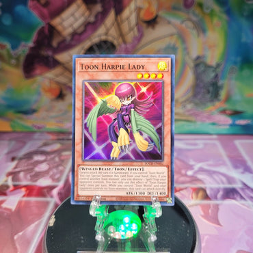 A Super Rare "Toon Harpie Lady" card from the Yugioh Set: Toon Chaos.