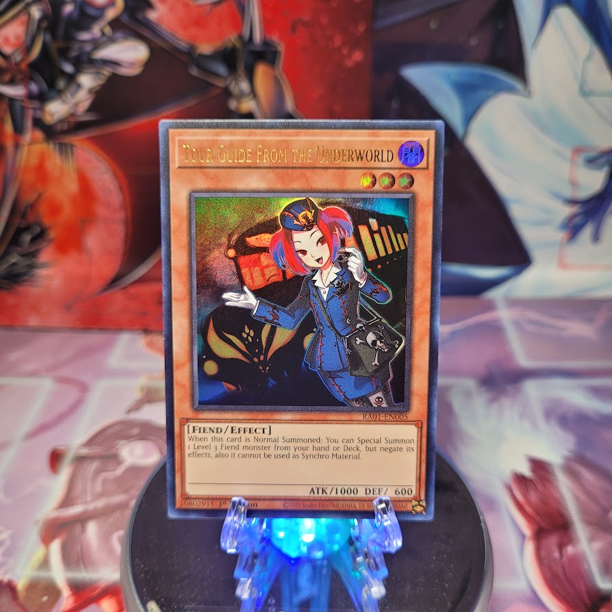 An Ultra Rare "Tour Guide From the Underworld" card from the Yugioh Set: Rarity Collection 1 (RA01).