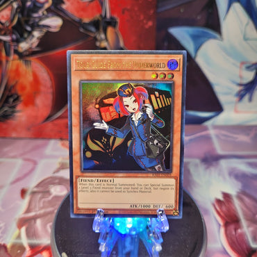 An Ultra Rare "Tour Guide From the Underworld" card from the Yugioh Set: Rarity Collection 1 (RA01).