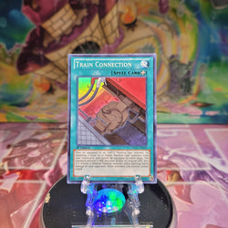 A Super Rare "Train Connection" card from the Yugioh Set: Dragons of Legend.