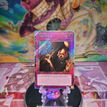 A Platinum Secret Rare "Trap Hole" card from the Yugioh Set: Quarter Century Bonanza (RA03)