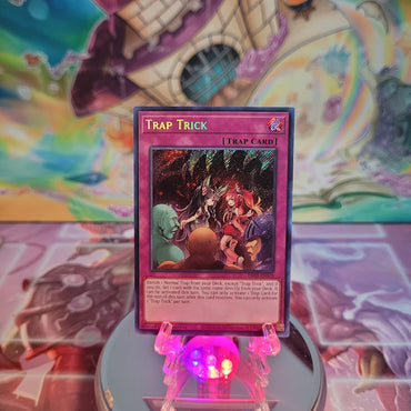 A Secret Rare "Trap Trick" card from the Yugioh Set: Quarter Century Bonanza (RA03).