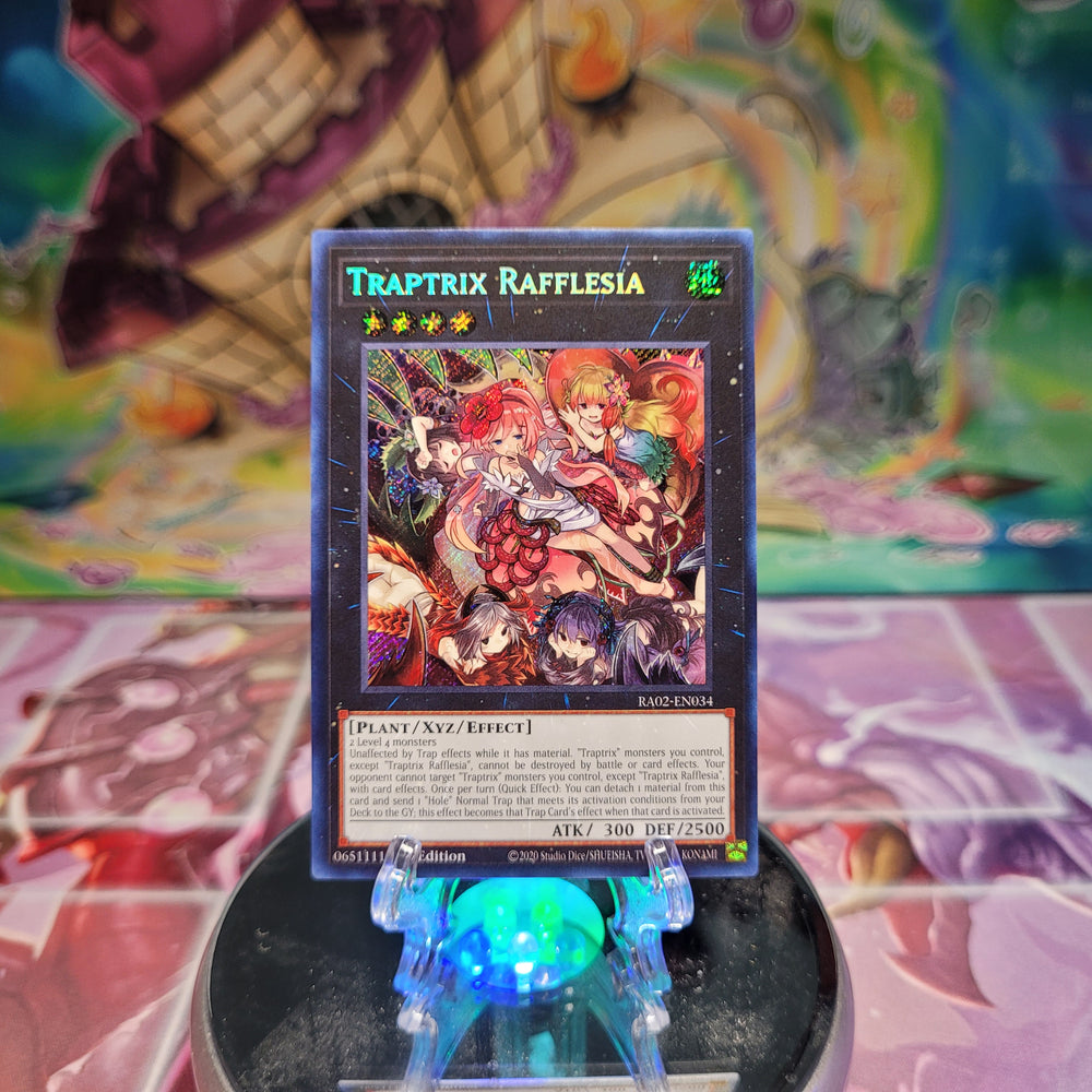 A Secret Rare "Traptrix Rafflesia" card from the Yugioh Set: Rarity Collection 2 (RA02).