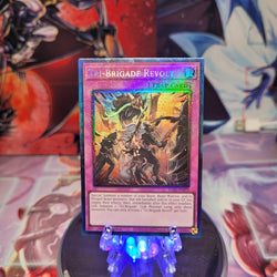 A Prismatic Collector's Rare "Tri-Brigade Revolt" card from the Yugioh Set: Rarity Collection 1 (RA01).