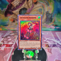 A Super Rare "Trickstar Rhodode" card from the Yugioh Set: Flames of Destruction.