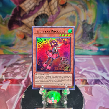 A Super Rare "Trickstar Rhodode" card from the Yugioh Set: Flames of Destruction.