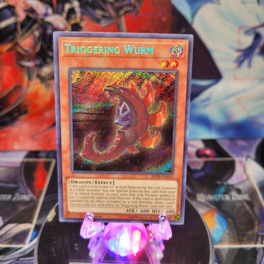 A Secret Rare "Triggering Wurm" card from the Yugioh Set: Battles of Legend: Relentless Revenge.