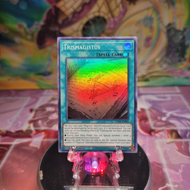 A 1st Edition Super Rare "Trismagistus" card from the Yugioh Set: Genesis Impact.