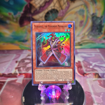 A 1st Edition Super Rare "Tsukahagi, the Poisonous Mayakashi" card from the Yugioh Set: Hidden Summoners.