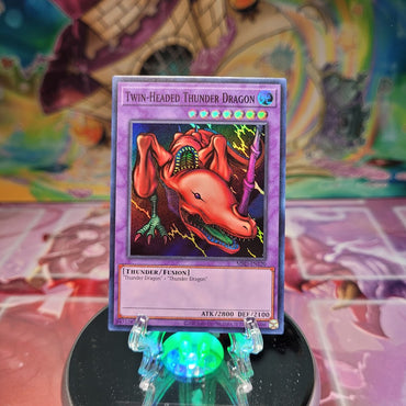A Super Rare 25th Anniversary "Twin-Headed Thunder Dragon" card from the Yugioh Set: Metal Raiders (MRD).