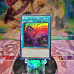 A Super Rare "Twin Twisters" card from the Yugioh Set: Rarity Collection 2 (RA02).