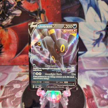 An Ultra Rare "Umbreon V" (094/203) card from the Pokemon Set: Evolving Skies.