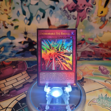 An Ultra Rare "Unbreakable Xyz Barrier" card from the Yugioh Set: Battles of Legend: Glorious Gallery (BLGG).