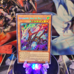 A Secret Rare "Unchained Soul of Disaster" card from the Yugioh Set: Chaos Impact.