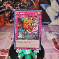A Secret Rare "Underdog" card from the Yugioh Set: Blazing Vortex (BLVO).