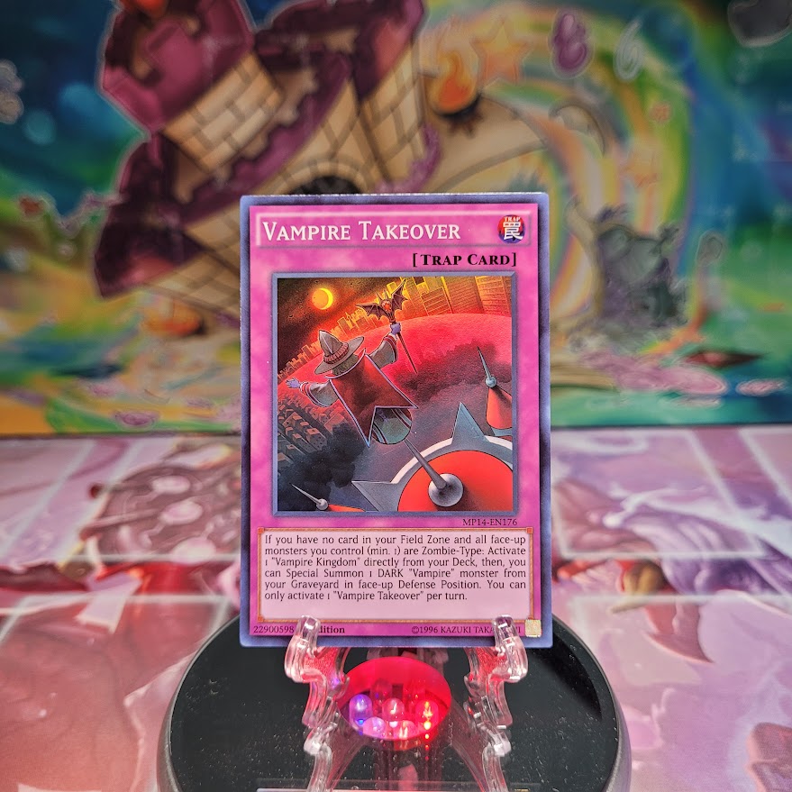 A Super Rare "Vampire Takeover" card from the Yugioh 2014 Mega-Tin Mega Pack.