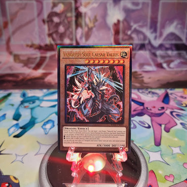 A Prismatic Ultimate Rare "Vanquish Soul Caesar Valius" card from the Yugioh Set: Quarter Century Stampede (RA04).