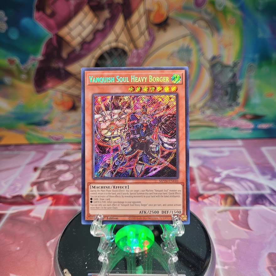 A Prismatic Secret Rare "Vanquish Soul Heavy Borger" card from the Yugioh 25th Anniversary Tin: Dueling Mirrors (MP24).