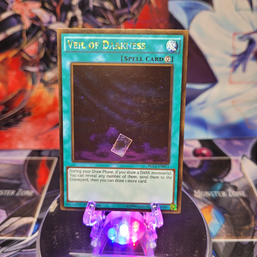 A Gold Rare "Veil of Darkness" card from the Yugioh Set: Premium Gold: Return of the Bling.