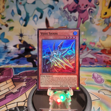 A Super Rare "Veiss Shark" card from the Yugioh Set: Maze of Muertos (MZMU).