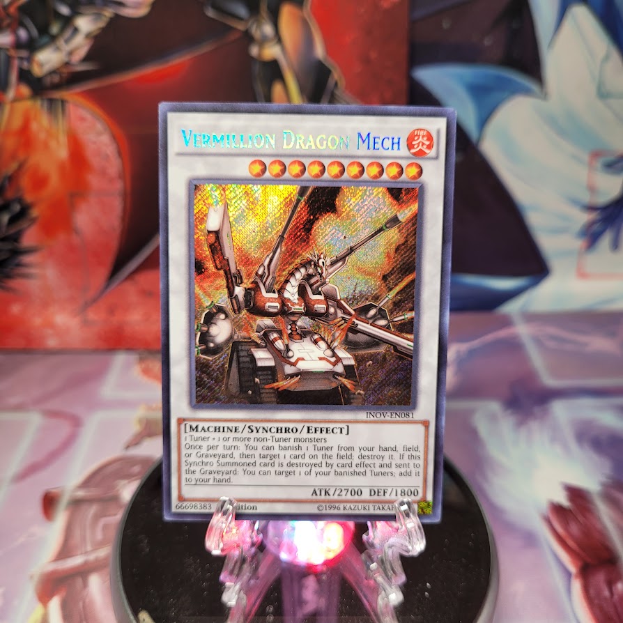 A Secret Rare "Vermillion Dragon Mech" card from the Yugioh Set: Invasion: Vengeance.