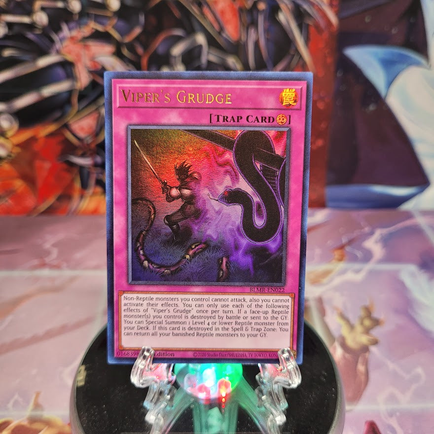 An Ultra Rare "Viper's Grudge" card from the Yugioh Set: Battles of Legend: Monstrous Revenge.