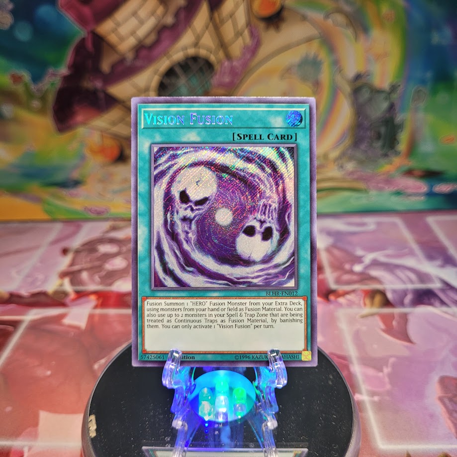 A Secret Rare "Vision Fusion" card from the Yugioh Set: Battles of Legend: Hero's Revenge (BLHR).