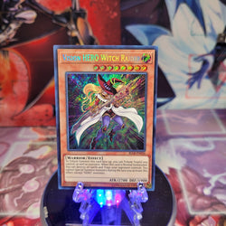A Secret Rare "Vision Hero Witch Raider" card from the Yugioh Set: Battles of Legend: Light's Revenge (BLLR).
