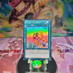 A Super Rare "Vylon Segment" card from the Yugioh Set: Hidden Arsenal 6: Omega Xyz.