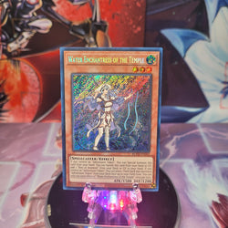 A Secret Rare "Water Enchantress of the Temple" card from the Yugioh Set: Battles of Legend: Monstrous Revenge (BLMR).