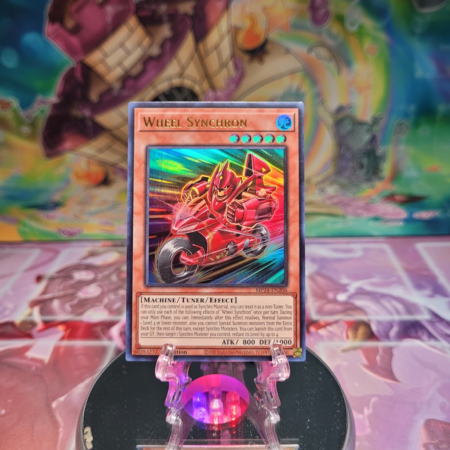 An Ultra Rare "Wheel Synchron" card from the Yugioh Set: 25th Anniversary Tin: Dueling Mirrors.