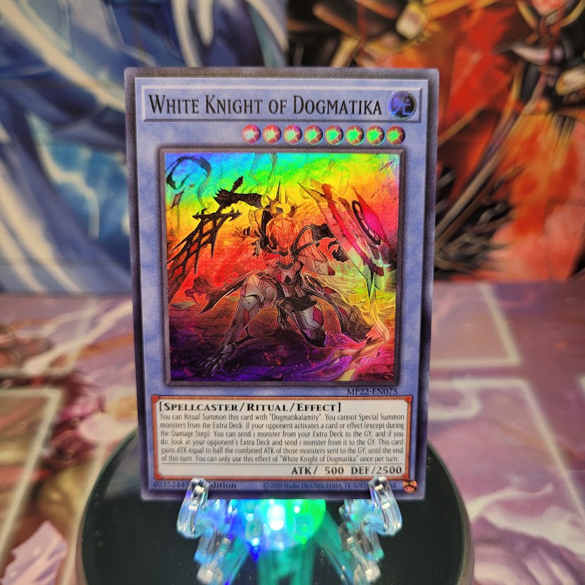 A Super Rare "White Knight of Dogmatika" card from the Yugioh 2022 Tin of the Pharaoh's Gods Set (MP22).