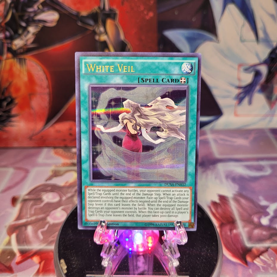An Ultra Rare "White Veil" card from the Yugioh Set: Duelist Saga.