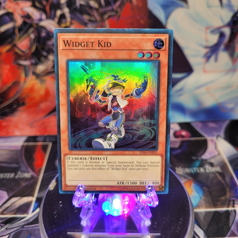 A Super Rare "Widget Kid" card from the Yugioh Starter Deck: Codebreaker set.