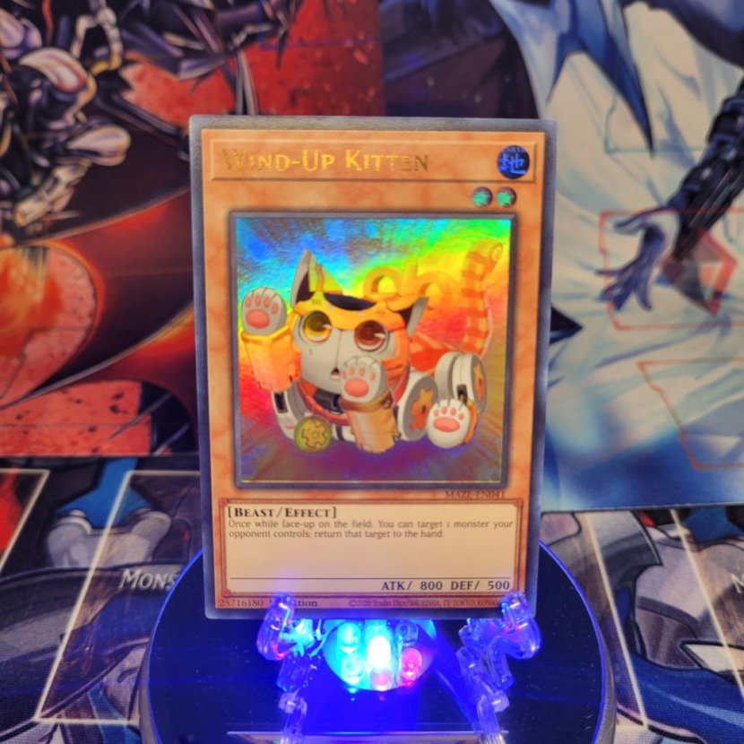 An Ultra Rare "Wind-Up Kitten" card from the Yugioh Set: Maze of Memories.