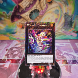 A Platinum Secret Rare "Wind-Up Zenmaines" card from the Yugioh Set: Quarter Century Stampede (RA04).