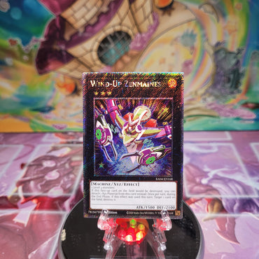 A Platinum Secret Rare "Wind-Up Zenmaines" card from the Yugioh Set: Quarter Century Stampede (RA04).