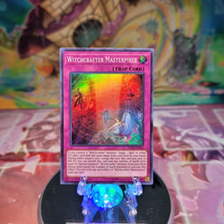  A Super Rare "Witchcrafter Masterpiece" card from the Yugioh Set: The Infinity Chasers.