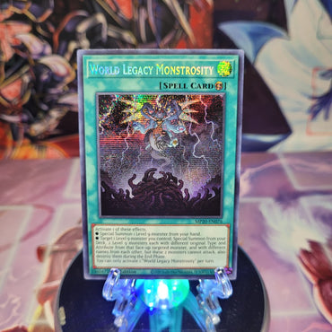 A Prismatic Secret Rare "World Legacy Monstrosity" card from the Yugioh 2020 Tin of Lost Memories.