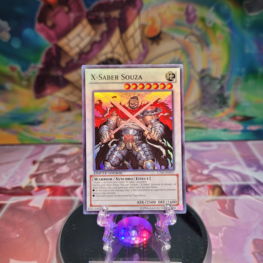 A Super Rare "X-Saber Souza" card from the Yugioh 2012 Collector Tins.