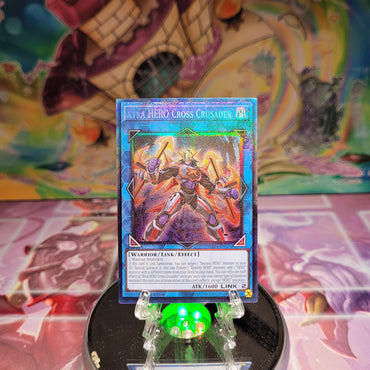 A Prismatic Collector's Rare "Xtra Hero Cross Crusader" card from the Yugioh Set: Quarter Century Stampede (RA04).