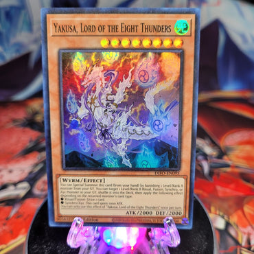  A Super Rare "Yakusa, Lord of the Eight Thunders" card from the Yugioh Set: Dimension Force.